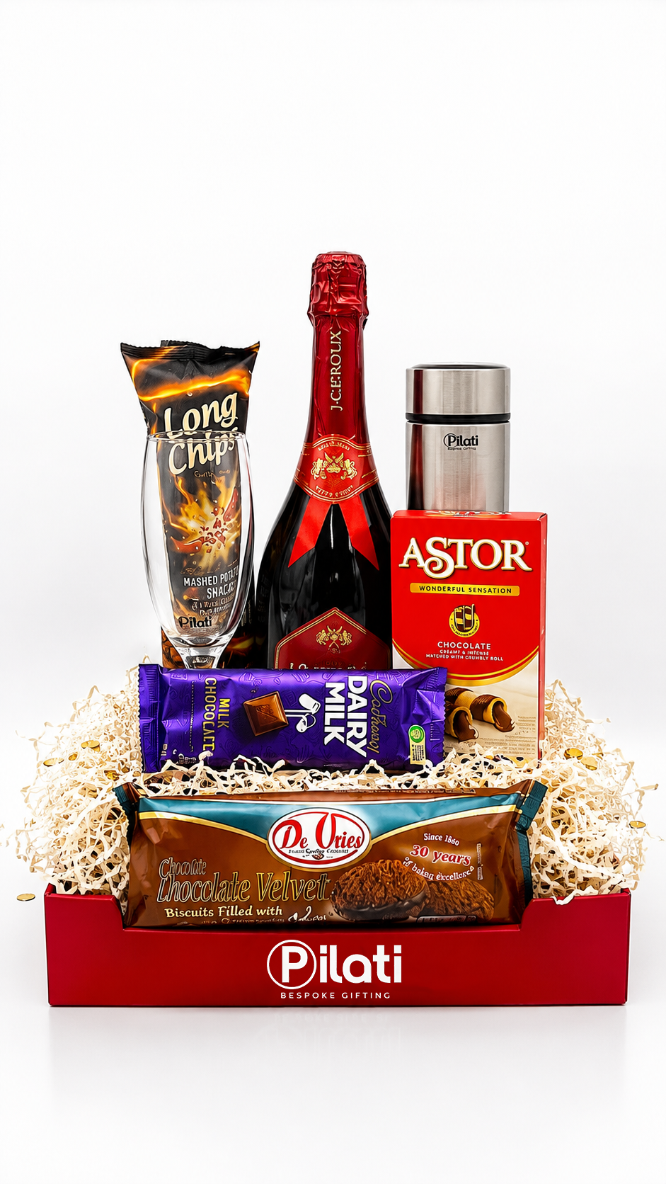 A Pilati branded gift basket containing  a bag of Long Chips, a box of Astor, a chocolate bar, arranged in a red basket with white filler on a white background.